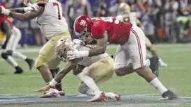  ?? ALABAMA PHOTO/KENT GIDLEY ?? Alabama defensive lineman Raekwon Davis ignited his stellar sophomore season in 2017 with this sack against Florida State, but his junior year with the Crimson Tide was not as productive.