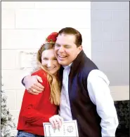  ?? (NWA Democrat-Gazette/Marc Hayot) ?? High school teacher Tamara Stewart (left) receives a check for $1,000 and a hug from Torres. Stewart won the money for her project Building Thinking Classrooms in Mathematic­s.