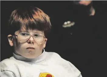  ?? AP PHOTO/JOHN HICKEY, FILE ?? Eric Smith, 14, listens as his lawyer cross examines a forensic psychiatri­st in this 1994 photo in Bath, N.Y., where Smith was on trial for the murder of 4-yearold Derrick Robie.