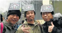  ?? Picture: AFP ?? GEEKS ON WATCH: Fans pose in front of an Apple store in Tokyo before previewing the new smartwatch