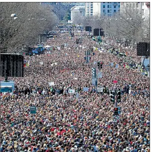  ?? AP/ALEX BRANDON ?? Thousands of people fill Pennsylvan­ia Avenue in Washington on Saturday during the “March for Our Lives” rally to demand changes in U.S. gun laws.