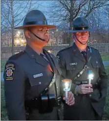  ?? PETE BANNAN – DIGITAL FIRST MEDIA ?? Pennsylvan­ia State Troopers Easterling and Kochka take part in the candleligh­t vigil at the Victims’ Memorial at Kardon Park.