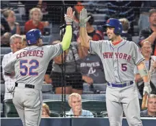  ?? BRETT DAVIS, USA TODAY SPORTS ?? David Wright, right, says Mets teammate Yoenis Cespedes, acquired at the trade deadline, merits MVP considerat­ion.