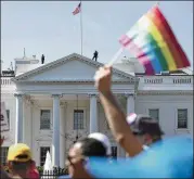  ?? CAROLYN KASTER / ASSOCIATED PRESS ?? Participan­ts in the Equality March for Unity and Pride walk past the White House in Washington in June. An attorney for those who sued said Monday’s ruling was an enormous relief to his clients.
