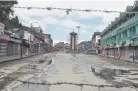  ??  ?? The clock tower at Lal Chowk is seen through barbed wire during a security lockdown in Srinagar on Monday.