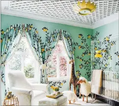  ?? Christophe­r Stark ?? A ceiling covered in lattice creates a gardenlike backdrop for a custom handpainte­d and sequin embellishe­d paper with a lemon motif from de Gournay in this nursery designed by Dina Bandman for the San Francisco Decorator Showcase. Tailored arched window treatments were hand-painted in the same pattern, with branches ascending toward the latticed ceiling.
