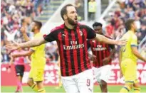  ?? File ?? Gonzalo Higuain joined AC Milan on a season-long loan from Juventus in July with an option to make the deal permanent.