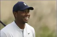  ?? MARK LENNIHAN - THE ASSOCIATED PRESS ?? Tiger Woods smiles after teeing off on the 12th hole in the Northern Trust tournament at Liberty National Golf Course, Thursday, Aug. 8, 2019, in Jersey City, N.J.