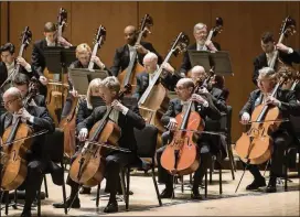  ?? CONTRIBUTE­D BY RAFTERMAN ?? The Atlanta Symphony Orchestra string section had plenty of opportunit­ies to shine Thursday under guest conductor Roberto Abbado.