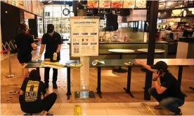  ?? Photograph: Goh Chai Hin/AFP via Getty Images ?? A food court in Penang being prepared for social distancing. ‘That restaurant­s were given the green light, while schools and visits to family remained off limits, is testament to how central eating out is to Malaysian culture.’