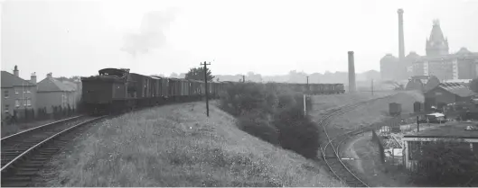  ?? W S Sellar ?? Chancelot flour mill dominates the horizon as Reid ‘J37’ class 0-6-0 No 64554 rounds the curve at Bonnington on the 1902-built Caledonian branch from Newhaven Junction to South Leith docks on 13 September 1961. The mill was served by both the NBR/LNER Edinburgh, Leith & Granton Railway and by a north-facing line off the ‘Caley’ route. Sadly the mill suffered an explosion and was gutted by fire in 1967 – it was eventually pulled down in 1971 whilst a new modern facility had been built in Leith Western harbour to replace it. Shortly after passing over the NBR’s North Leith goods route – not to be confused with the similarly named CR terminus just to its west – the train continues towards Leith (East) depot, to use its BR era name – it was formerly known as Leith South by the CR. Below the branch, a lone box van resides in the weed strewn sidings of Bonnington goods yard. The Leith New Lines of 1902 continued through to Seafield, where a two-road engine shed was built. Rather late on the scene in this vicinity, the Edinburgh & Dalkeith Railway reached South Leith from Portobello in 1838 (and it was NB owned from 1845), the ‘Caley’ found itself leasing its engine shed to the North British Railway in World War I.