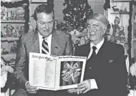  ?? THE OKLAHOMAN FILE ?? Oklahoma entertaine­rs Ridge Bond, left, and Ralph Blane look over a copy of “Have Yourself A Merry Little Christmas.” Blane co-wrote the song in 1944.