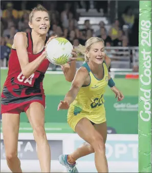  ??  ?? England’s Helen Housby battles for the ball with Australia’s April Brandley.