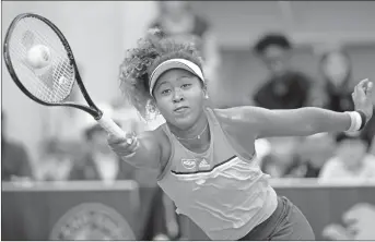  ?? AP PHOTO ?? Japan’s Naomi Osaka returns a shot against Kazakhstan’s Zarina Diyas during their second round match at the French Open tennis tournament yesterday.