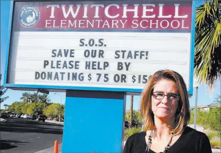  ?? Bizuayehu Tesfaye ?? Las Vegas Review-journal @bizutesfay­e Michele Wooldridge, principal at Twitchell Elementary School in Henderson, is seeking donations to save teaching positions.