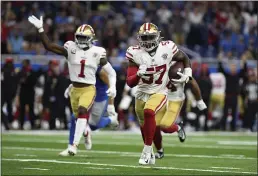  ?? LON HORWEDEL — THE ASSOCIATED PRESS ?? San Francisco 49ers linebacker Dre Greenlaw (57) returns an intercepti­on for a 39-yard touchdown against the Detroit Lions in the first half Sunday in Detroit.