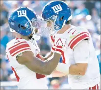  ?? AP ?? TOGETHER AGAIN: When the Giants came to a lastminute deal with QB Daniel Jones (right), that meant Saquon Barkley (left) was going to get the franchise tag. The team now has until July 17 to get a multiyear deal done with its star running back.