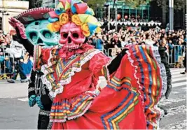  ?? GETTY ?? Mexico City only recently began holding elaborate parades tied to the holiday after a fictional version was depicted in a 2015 James Bond film.