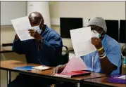  ?? ?? San Quentin inmates attend a Mount Tamalpais College English class at the prison.