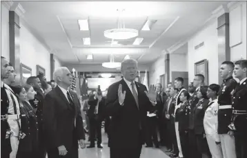  ?? ASSOCIATED PRESS ?? IN THIS JULY 20, 2017, file photo, President Donald Trump stops to answer a reporter’s question after greeting military personnel during a visit to the Pentagon. Watching is Vice President Mike Pence. With Russia in mind, the Trump administra­tion is...