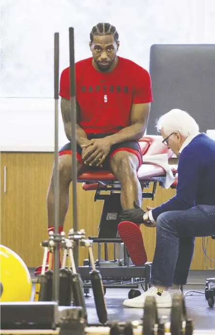 ?? Stan Behal ?? Toronto star forward Kawhi Leonard receives treatment after practice on Tuesday before the Raptors flew to Milwaukee for Game 1 of the Eastern Conference final against the Bucks.