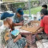  ??  ?? Images of Shigeharu Shirai playing draughts went viral on the internet, leading to his capture.