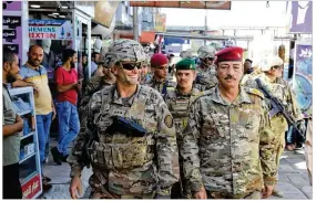  ?? SPC. AVERY HOWARD / U.S. ARMY ?? Lt. Gen. Paul E. Funk II (left), commanding general of Operation Inherent Resolve, strolls through Mosul, Iraq, in October with Iraqi Maj. Gen. Najm Abdullah alJibouri. In a briefing with Central Texas media Monday morning via teleconfer­ence from Iraq,...