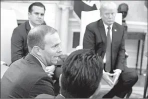  ?? AP/EVAN VUCCI ?? President Donald Trump and Gov. Ricardo Rossello of Puerto Rico (left) attend a meeting Thursday at the White House along with FEMA Director Brock Long and others.