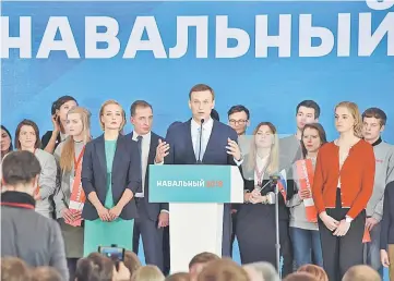  ??  ?? Navalny delivers a speech during a meeting with his supporters in Moscow. — AFP photo