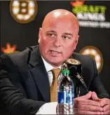  ?? Steven Senne / Associated Press ?? Boston Bruins newly hired coach Jim Montgomery takes questions from members of the media on Monday.