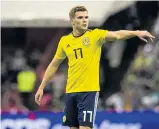  ??  ?? Debut Chris Cadden in action for Scotland