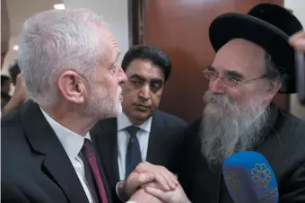  ??  ?? Jeremy Corbyn meeting with faith leaders at Finsbury Park Mosque after a terrorist attack on Muslim pedestrian­s during Ramadan, London, June 2017