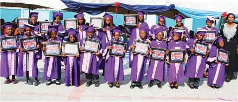  ??  ?? Pupils of Lagos Creative Palm School, Festac Lagos, during their graduation ceremony.