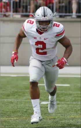  ?? THE ASSOCIATED PRESS FILE ?? Ohio State running back J.K. Dobbins plays in the spring football game in Columbus in April.