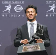  ?? Craig Ruttle / Associated Press ?? Trophy-winner Kyler Murray follows Baker Mayfield to make Oklahoma the first school with back-to-back Heisman QBs.