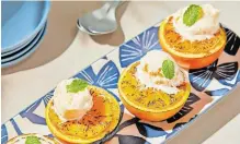  ?? | TOM MCCORKLE; styling GINA NISTICO ?? GRILLED oranges with cardamom and ice cream. for The Washington Post