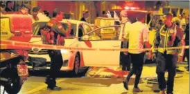  ?? AFP ?? Police and medics at the scene of an attack in the central city of Elad, Israel on Thursday.