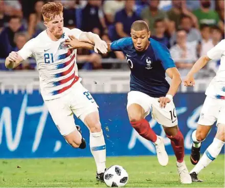  ?? EPA PIC ?? France’s Kylian Mbappe (right) vies with Tim Parker of the US during their friendly match on Saturday.