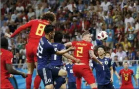  ?? THE ASSOCIATED PRESS ?? Belgium’s Marouane Fellaini, left, heads for the ball to score his side’s second goal during the round of 16 match between Belgium and Japan at the World Cup.