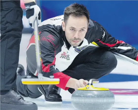  ?? ANDREW VAUGHAN / THE CANADIAN PRESS ?? Ontario skip John Epping delivers a rock on Thursday against wild card Mike McEwen’s rink in the championsh­ip round at the Tim Hortons Brier in Regina. Epping scored two in the ninth end and stole two in the 10th to win the game 8-7.