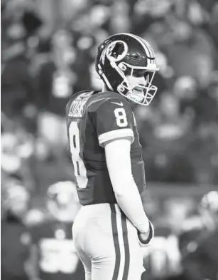  ?? Rob Carr, Getty Images ?? Quarterbac­k Kirk Cousins said farewell to Redskins fans and briefly tagged the Jets and Vikings on his post. Later, those tags were deleted.