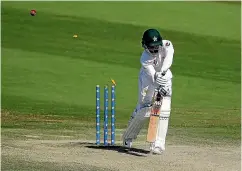  ?? GETTY IMAGES ?? Pakistan opener Mohammad Hafeez is clean bowled by Tim Southee for 8 as New Zealand chased a memorable victory on the final day of the third test in Abu Dhabi.