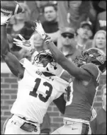  ?? Rogelio V. SolisThe Associated Press ?? Auburn cornerback Javaris Davis thwarts a pass intended for Mississipp­i wide receiver Braylon Sanders in the first half of the Tigers’ 31-16 win Saturday.