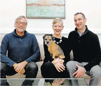  ??  ?? Architect Kendall Dorman and his dog, Raye, with Susan Pitman, centre, and David Feinstein. Feinstein said there was an inherent challenge in the renovation: how to respect history while moving forward.