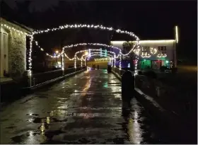  ??  ?? Strings of lights form a series of arches over the bridge across the Tulpehocke­n Creek at Gring’s Mill Recreation Area. A scaled-back version of county park’s annual Holiday Lights attraction opened Friday.