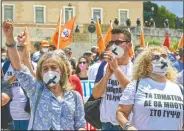  ??  ?? Protesters take part in a rally.