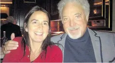  ??  ?? Francesca CarposYoun­g, pictured in a Facebook post with singer Tom Jones. The professor is claiming she was unfairly dismissed from her role