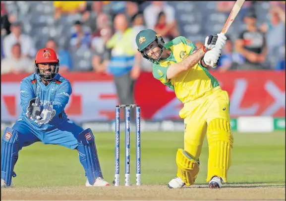  ?? Picture: REUTERS ?? Australia’s Glenn Maxwell hits the winning runs in an earlier clash against Afghanista­n.