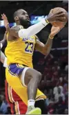  ?? AP photo ?? Los Angeles forward LeBron James (23) goes to the basket in the first half of a game against New Orleans Pelicans on Tuesday in New Orleans.