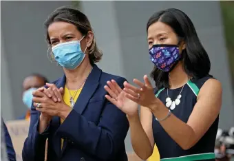  ?? MATT STONE / hErAld STAFF ?? HEATING UP: Mayoral candidates Annissa Essaibi-George and Michelle Wu attended a Boston protest against inhumane treatments of Haitians in Texas on Sept. 24.